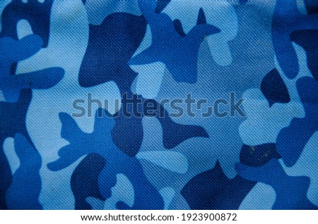 Blue camouflage pattern leather texture closeup, background.