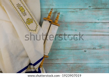 Day of jewish holidays symbols prayer shawl tallit, prayer holy torah scroll Royalty-Free Stock Photo #1923907019