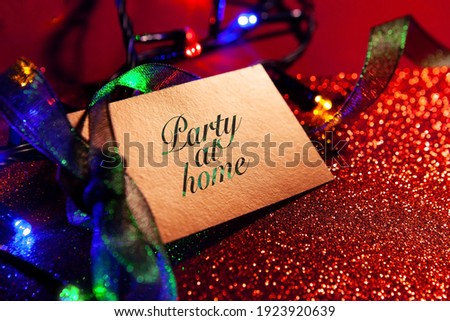 Label with a bright ribbon, bright festive luxury background, shiny glitter in red. 