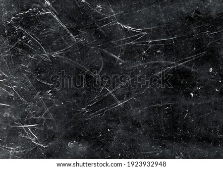 White scratches and dust on black background. Vintage scratched grunge plastic broken screen texture. Scratched glass surface wallpaper. Space for text Royalty-Free Stock Photo #1923932948