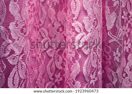 The texture of the lace fabric. Detail of the dress.
