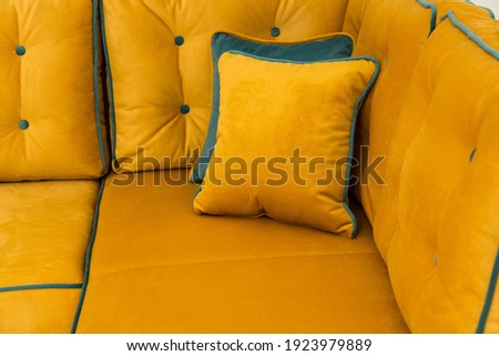 Yellow modern comfortable sofa in living room.