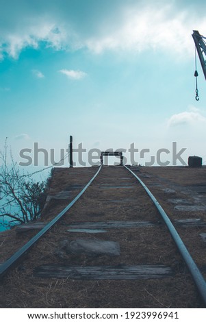 creative picture of track on top of mountain.