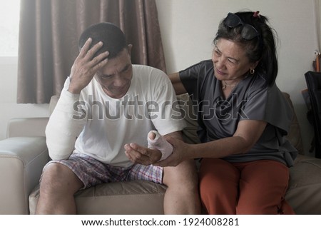 old asian man suffering from mental health depression have comforting from friend	 Royalty-Free Stock Photo #1924008281
