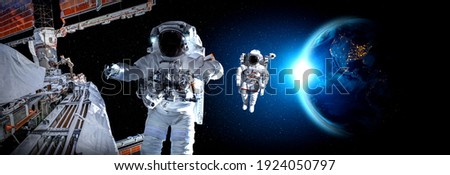 Astronaut spaceman do spacewalk while working for space station in outer space . Astronaut wear full spacesuit for space operation . Elements of this image furnished by NASA space astronaut photos. Royalty-Free Stock Photo #1924050797