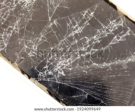 Broken glass of the phone on a white background. Close-up