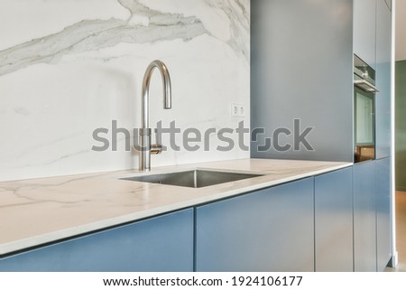 Close up of sink in luxury kitchen Royalty-Free Stock Photo #1924106177