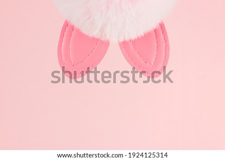 Bunny ears pink background. Spring holiday design. Easter background