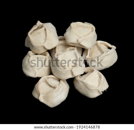 dumplings frozen on black background