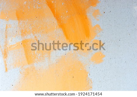 Background of old orange painted wall. Orange stains on the wall
