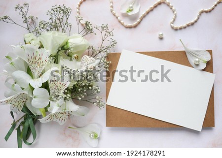  greeting card mockup. small bouquet of white flowers and space for text 