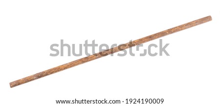 pointer, old dirty wooden stick isolated on wooden background Royalty-Free Stock Photo #1924190009