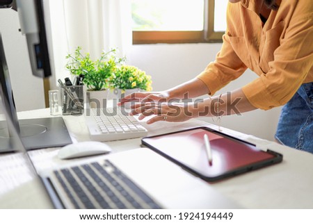 Young female designer artist drawing graphic for new design on tablet at home Art Design Drawing Business and creativity Website development concept