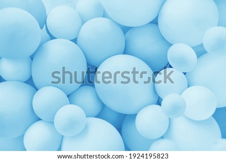 Light Blue balloons background, punchy pastel colored and soft focus. Party festive balloons photo wall birthday decoration for children. Background for wedding, anniversary, birthday. Royalty-Free Stock Photo #1924195823