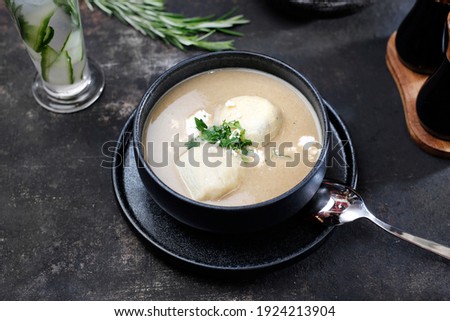 Cream soup. Creamy white vegetable soup. Food served on a plate, food styling, serving suggestions, culinary photography