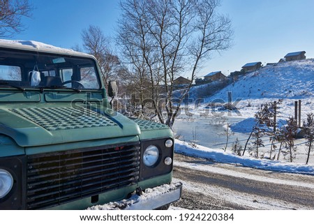 Snow nature cold road style. Winter season, outdoor frozen white floor. Green car.