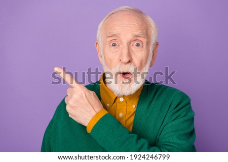 Photo of impressed person indicate finger empty space open mouth cant believe isolated on violet color background