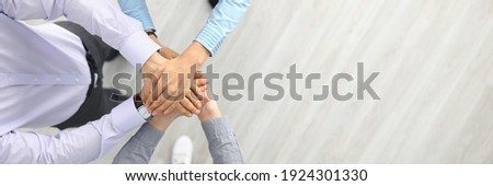 Businesswoman and businessmen are standing with their hands together. Successful businessmen teamwork and business agreement concept Royalty-Free Stock Photo #1924301330