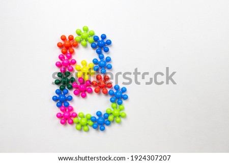 english letter from multi-colored puzzles on a white background