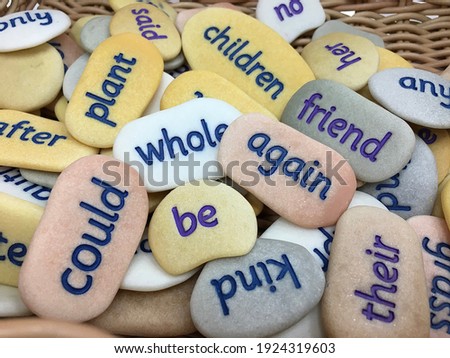 Tricky Word Pebbles. Made from unique stones, each pebble is engraved and painted with a high-frequency word Royalty-Free Stock Photo #1924319603