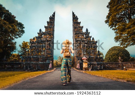 Woman with backpack exploring Bali, Indonesia.  Royalty-Free Stock Photo #1924363112