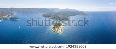 Aerial panoramic view of Host Island in Adriatic sea near town port of Vis Island in Croatia summer