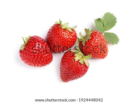 Delicious fresh red strawberries and green leaf on white background, top view
