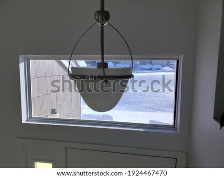 Light hanging in front of a window