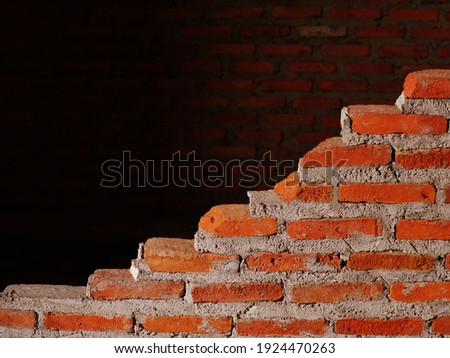 A brick wall being built.