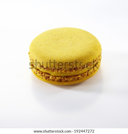 Tasty yellow macaroon isolate on with background 