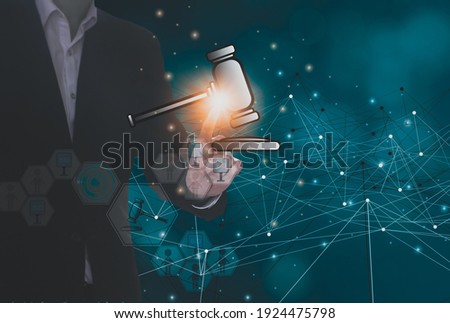 Businessman hand holding hammer icon,with futuristic line network, concept bid winner highest bidder in final lift,with public sale property auctioned business competition,e-auction and online bidding