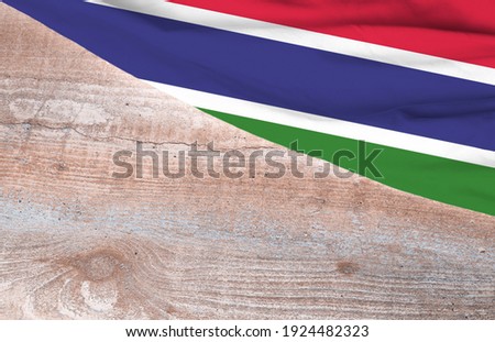 Flag Gambia and space for text on a wooden background