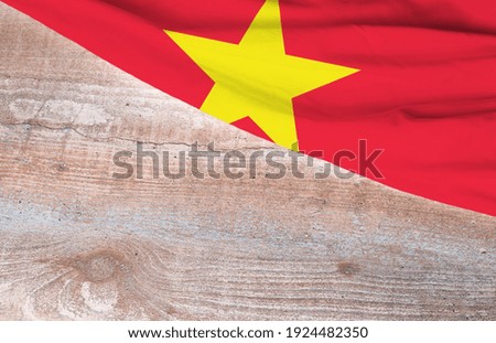 Flag Vietnam and space for text on a wooden background