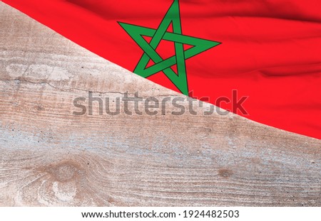 Flag Morocco and space for text on a wooden background