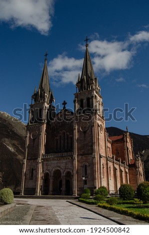 Covadonga basilica of neo-Romanic style located in Cangas de Onís, Asturias. In the background you can see the mountain where the victory cross that honors King Don Pelayo is located.