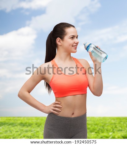 sport, exercise and healthcare - sporty woman with water bottle
