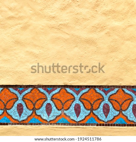 Mosaic Floral Ornament On Yellow Wall Background. Beautiful Oriental Flower Architecture Decor Pattern Background.