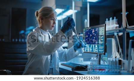 Medical Research Laboratory: Portrait of Female Scientist Working with Samples, using Micro Pipette Analysing Sample. Advanced Scientific Lab for Medicine, Biotechnology, Vaccine Development Royalty-Free Stock Photo #1924516388