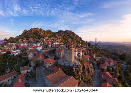 Drone aerial panorama view of Monsanto historic village at sunset, in Portugal