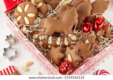 Pictures series soft gingerbread cookies with almonds in Christmas decoration