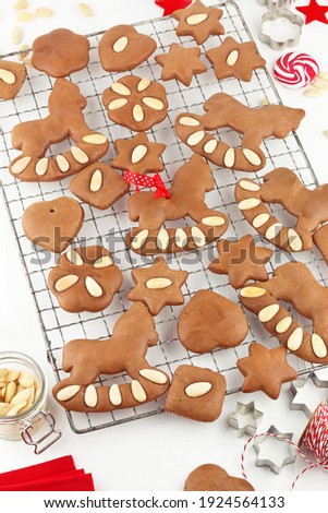 Pictures series soft gingerbread cookies with almonds in Christmas decoration