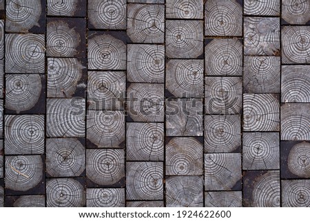 Background from gray wooden squares stacked together