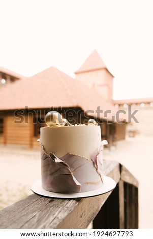 Beautiful handmade cake with double icing and stylish marble decoration