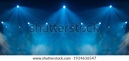 stage light with colored spotlights and smoke, concert and theatre scene  Royalty-Free Stock Photo #1924636547