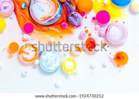 Fluid art texture. Abstract background with swirling paint effect. Liquid acrylic picture that flowing bubbles. Mixed paints for baner or wallpaper. Rainbow overflowing colors.