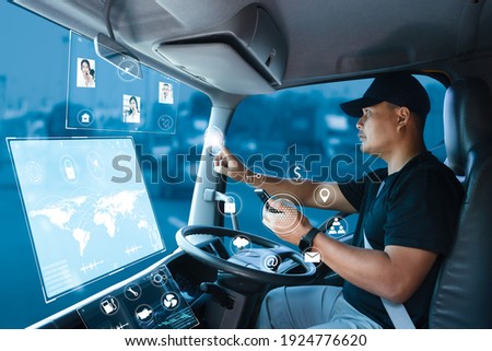 truck driver connects team call center through internet network. delivery man is searching for a location on a digitally displayed screen. Modern Transportation and driving tracking technology concept Royalty-Free Stock Photo #1924776620