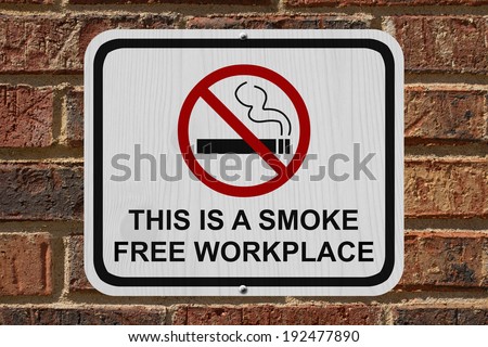 Smoking Free Workplace Sign, An red and white sign with cigarette icon and not symbol with text on a brick wall