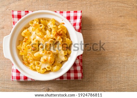 mac and cheese, macaroni pasta in cheesy sauce - American style Royalty-Free Stock Photo #1924786811