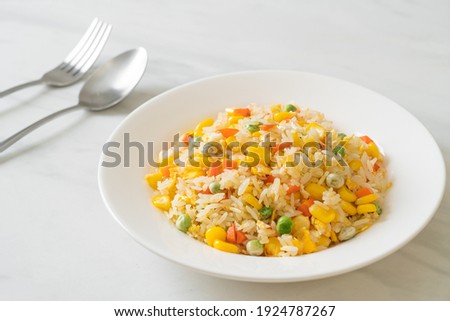 homemade fried rice with mixed vegetable (carrot, green bean peas, corn) and egg Royalty-Free Stock Photo #1924787267