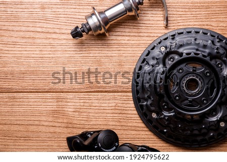 Mountain bike front hub bushing isolated on wooden background. Bicycle components. Cycling equipment.